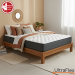 UltraFlex Stellar mattress with a white quilted top and grey sides on a wooden bed.