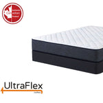 Close-up of the UltraFlex Radiance mattress corner above a dark foundation.