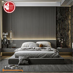 Dark bedroom with grey bedding, a low bed and a vertically ribbed feature wall.