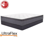UltraFlex Revive mattress with a white top and wave-patterned grey sides on a dark foundation.