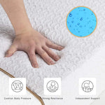 Hand pressing a mattress surface to illustrate foam cushioning and recovery.