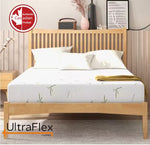 Front view of an UltraFlex EasySleep mattress on a wood slat bed.