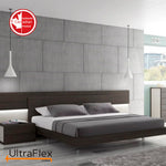 Contemporary bedroom with grey bedding, a dark wood bed frame and a tall panelled wall.