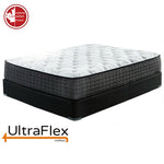UltraFlex Imperial mattress with a white quilted top on a black foundation.