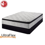 UltraFlex Oasis mattress with a quilted white top and grey sides on a black foundation.