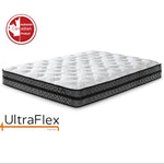 UltraFlex Joy mattress with a white quilted top and patterned dark sides.