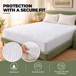 Comfort Living waterproof mattress protector with an elasticated skirt fitted around a mattress corner.