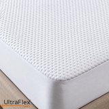 Comfort Living waterproof mattress protector with a textured white quilted top and fitted side panel.
