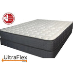 UltraFlex mattress with a white quilted top and dark grey sides, shown at an angle.
