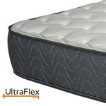 Close-up of the UltraFlex mattress corner and wave-patterned grey side fabric.