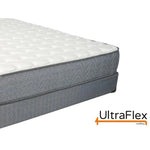 UltraFlex Majestic mattress showing the white quilted top and two-part grey side profile.